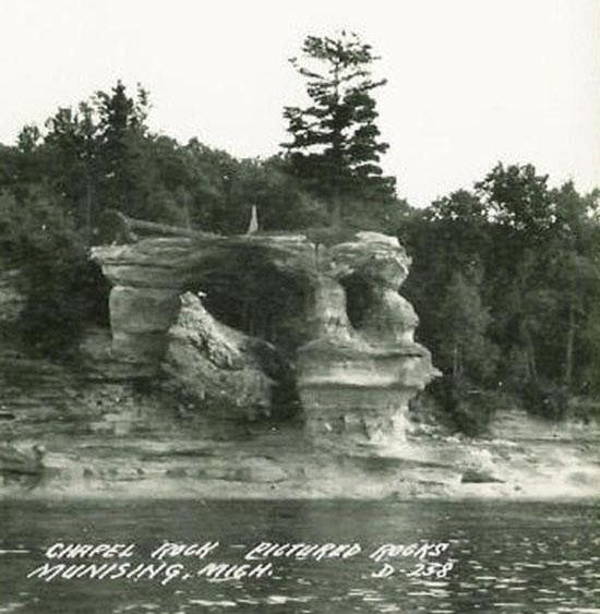 Chapel Rock, a unique sandstone formation that has a living white pine on top of it, is pictured in the 1900s. PC: National Park Service.
